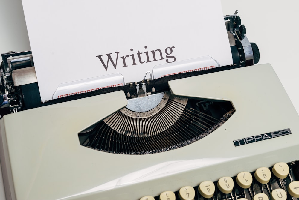 black and white typewriter on white table