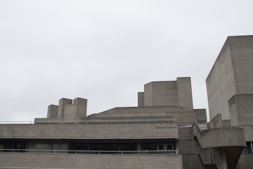 Brutalist architecture framed by cold, muted evening light.