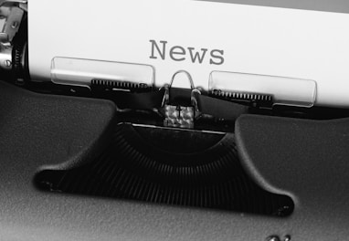 black and white typewriter on black table