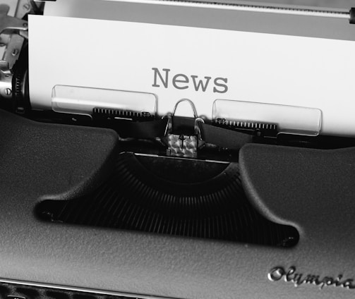 black and white typewriter on black table