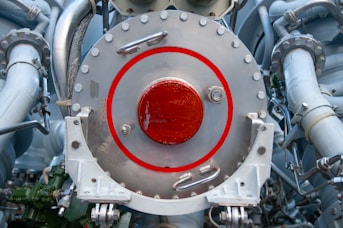 red and silver steel round equipment