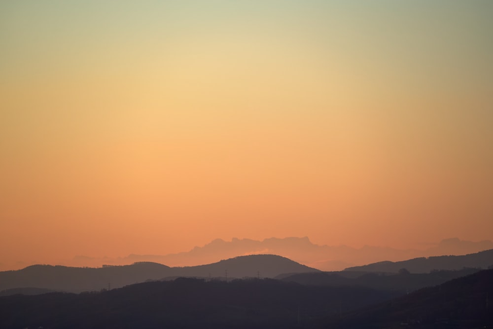 silhouette of mountains during daytime