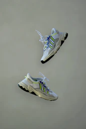 white and blue nike athletic shoes