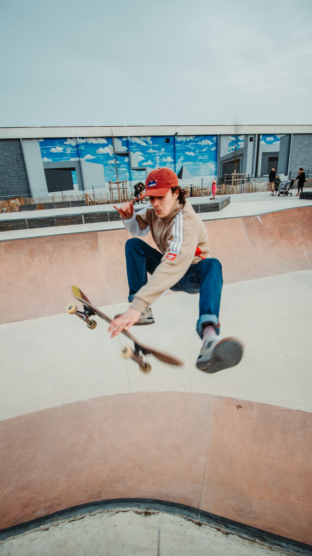 man in white long sleeve shirt playing skateboard