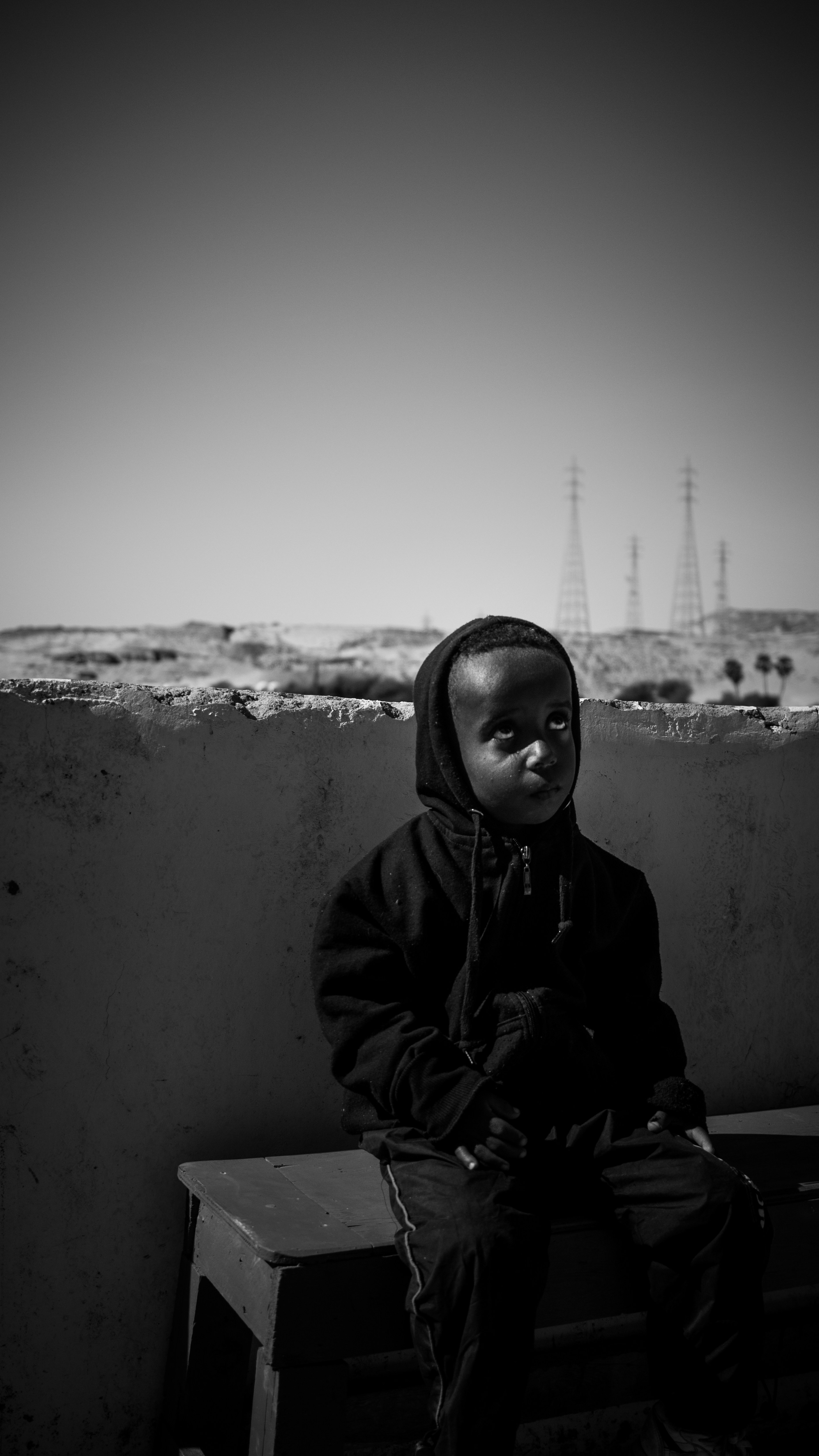grayscale photo of woman in hoodie