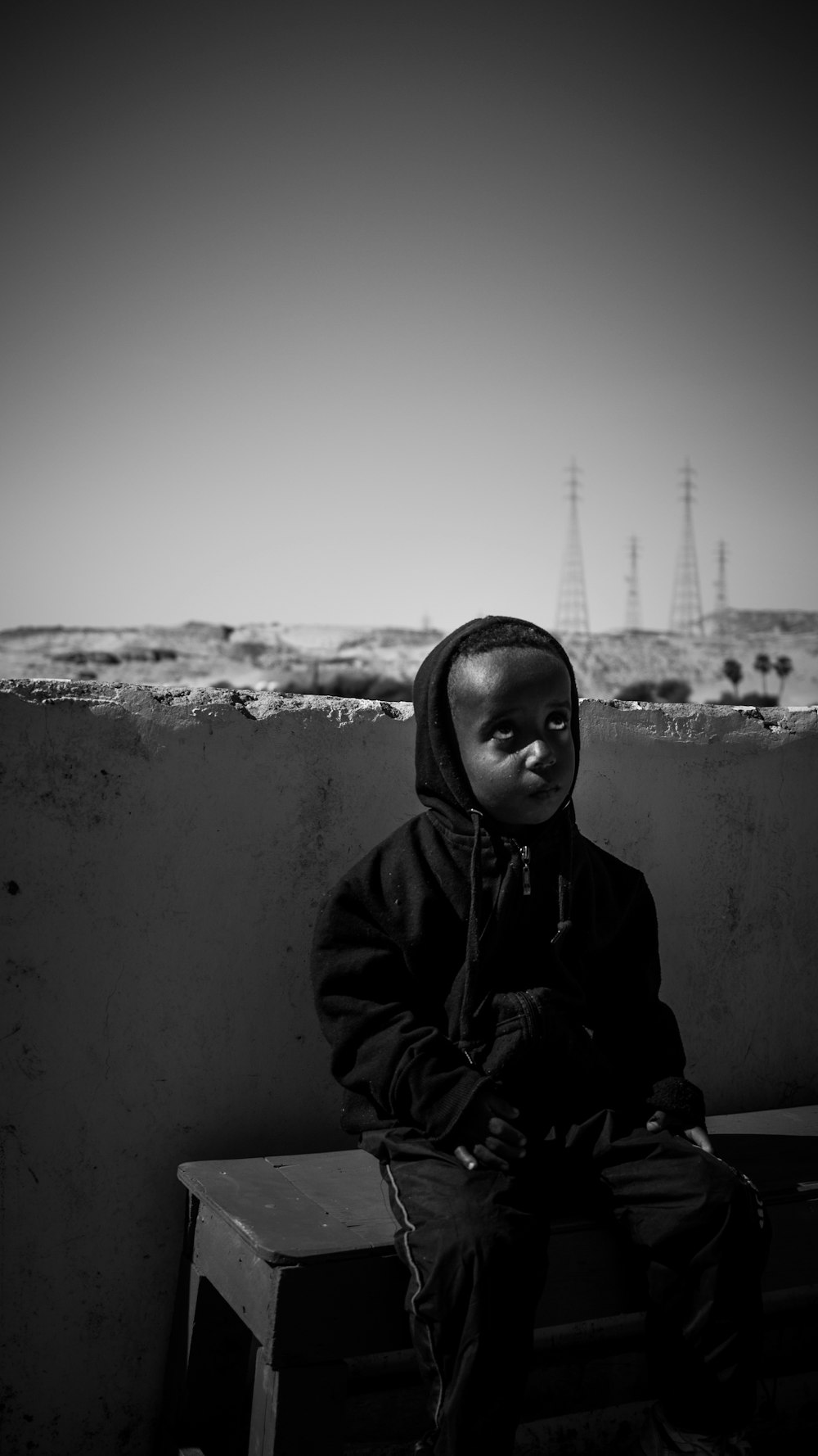 grayscale photo of woman in hoodie