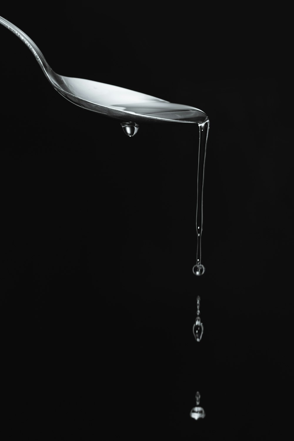 stainless steel faucet with water droplets