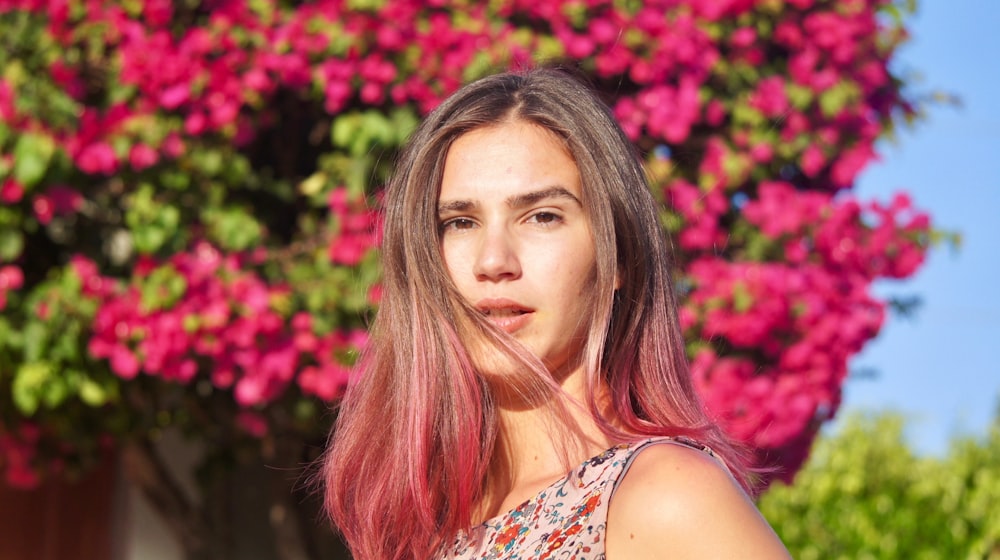 woman in white and red floral tank top