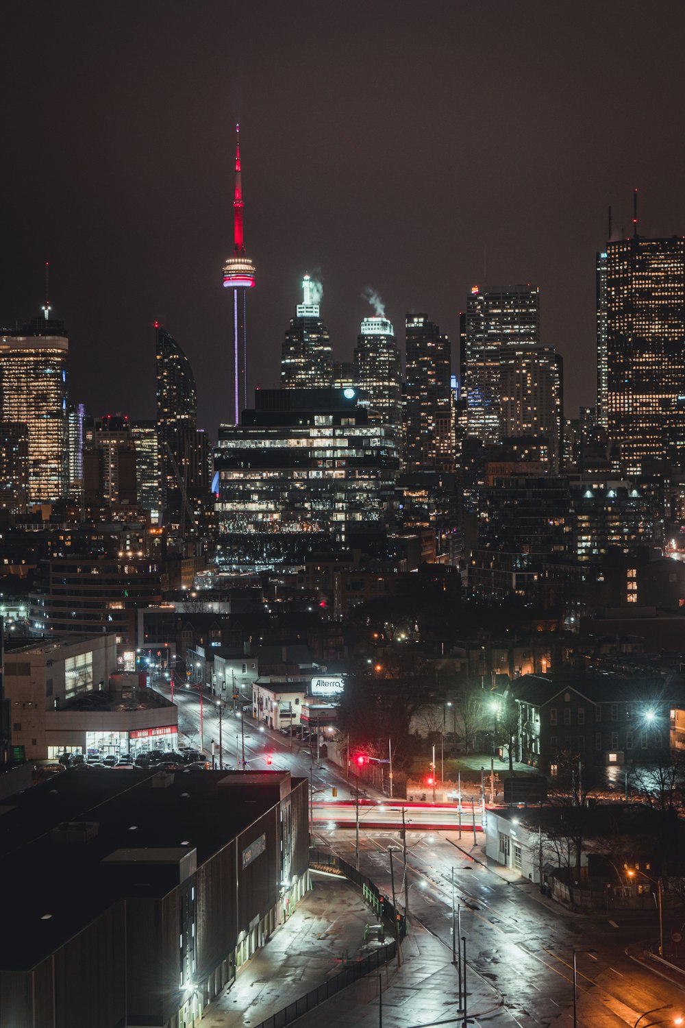 city with high rise buildings during night time