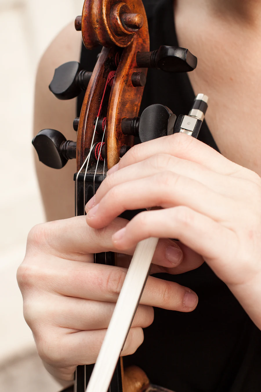 Close-up of a string instrument being played &mdash; viola and orchestra preparation in North Metro Atlanta