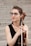 woman in black tank top playing brown violin