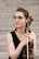 woman in black tank top playing brown violin