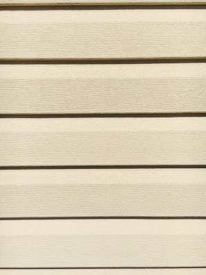 Professional contractor installing siding using a reliable, ergonomic product from Value Added Products LLC.