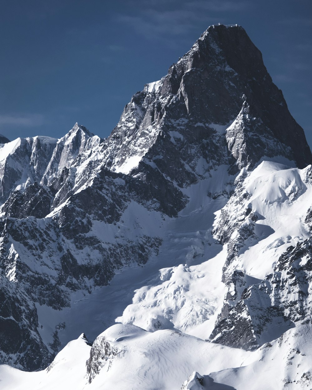 snow covered mountain under blue sky during daytime