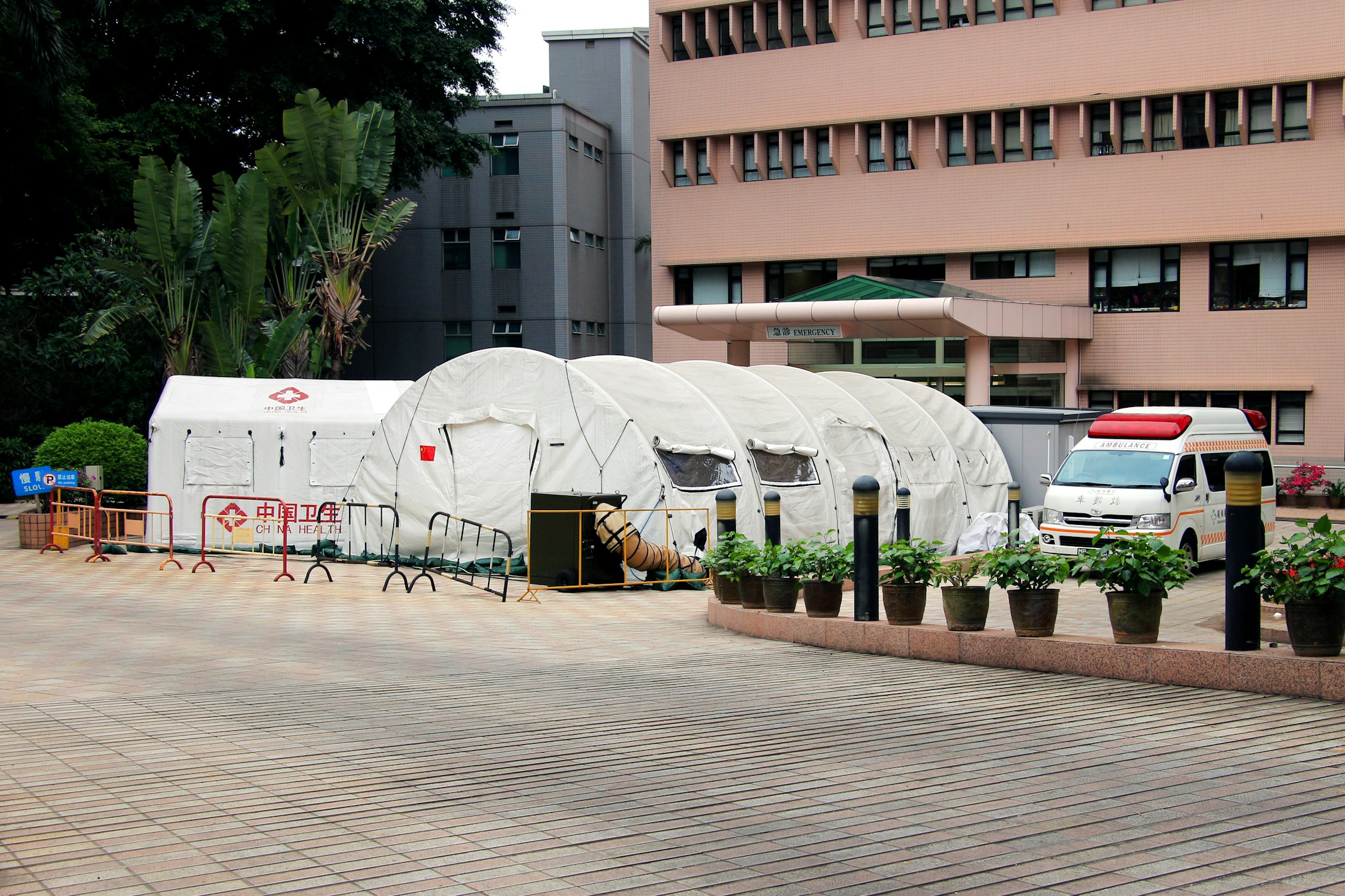 Medical tents assembled at the emergency entrance of Kiang Wu Hospital, Macau, China (Macau Photo Agency via Unsplash)