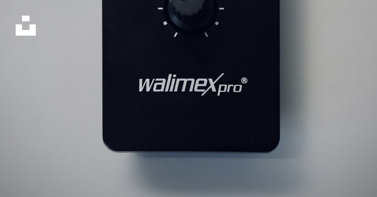 Black rectangular device on white table photo – Free Light Image on ...