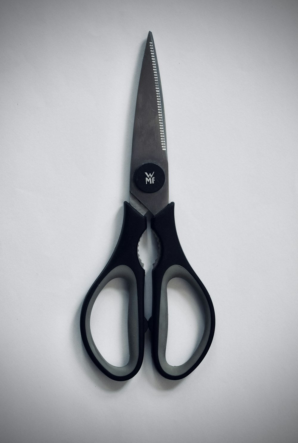 blue and red handled scissors
