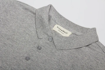 A neatly folded polo shirt in soft fabric with the yellow Sway Bound logo visible on the chest.