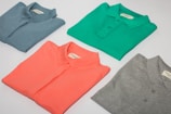 green crew neck shirt and gray crew neck shirt