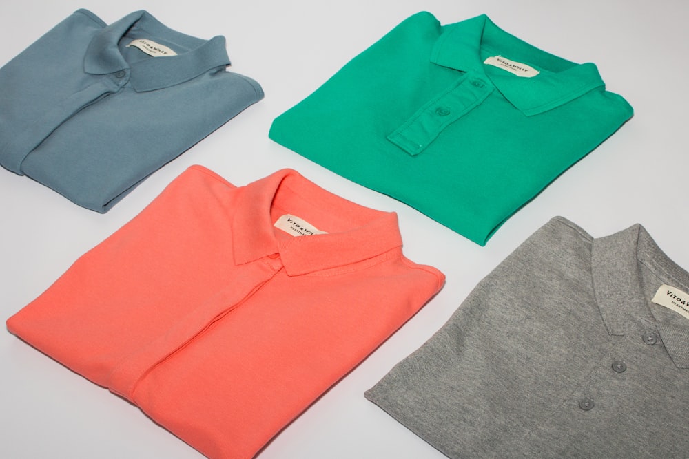 green crew neck shirt and gray crew neck shirt