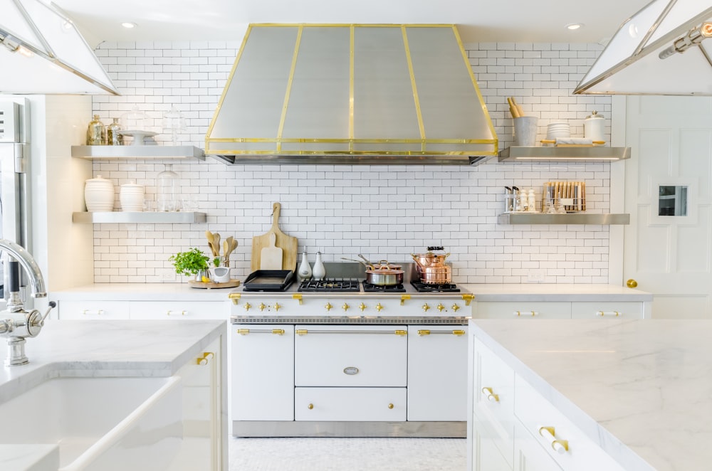 white kitchen cabinet near white stove oven