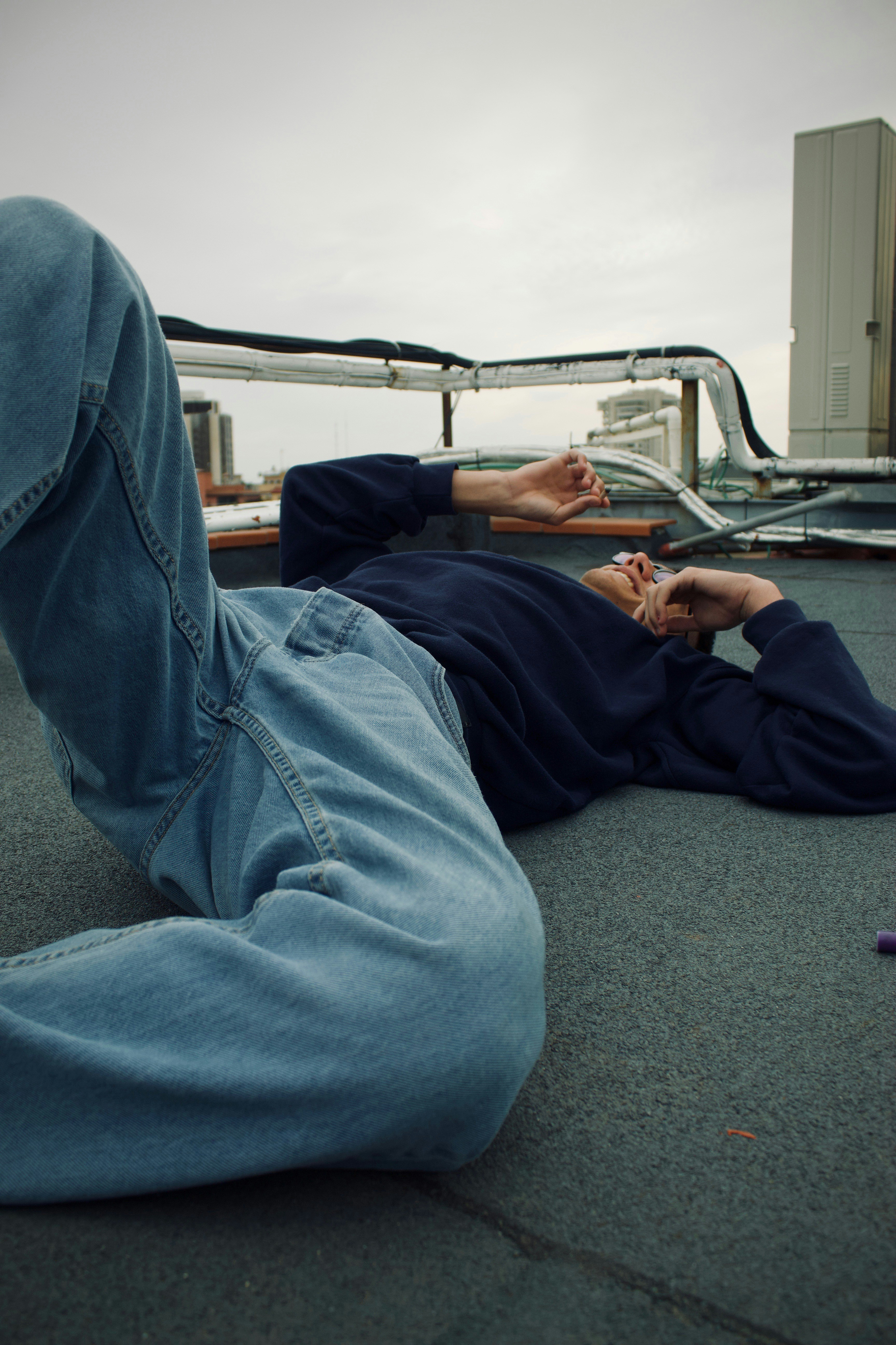 a person laying on the ground with their feet up
