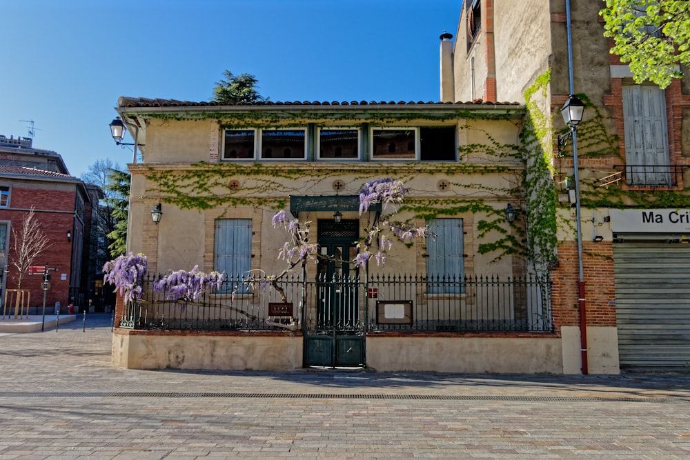 beige and green concrete house under blue sky during daytime