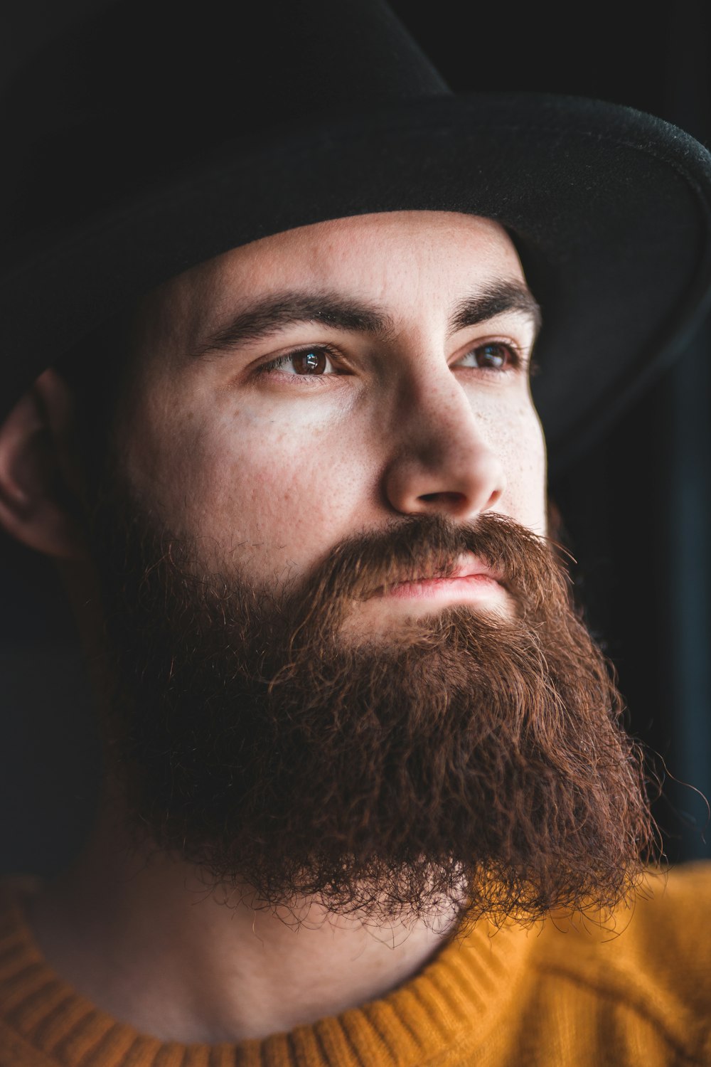 man in black hat and black shirt