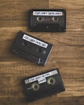 black cassette tape on brown wooden table