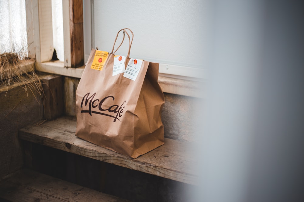 brown paper bag on white table