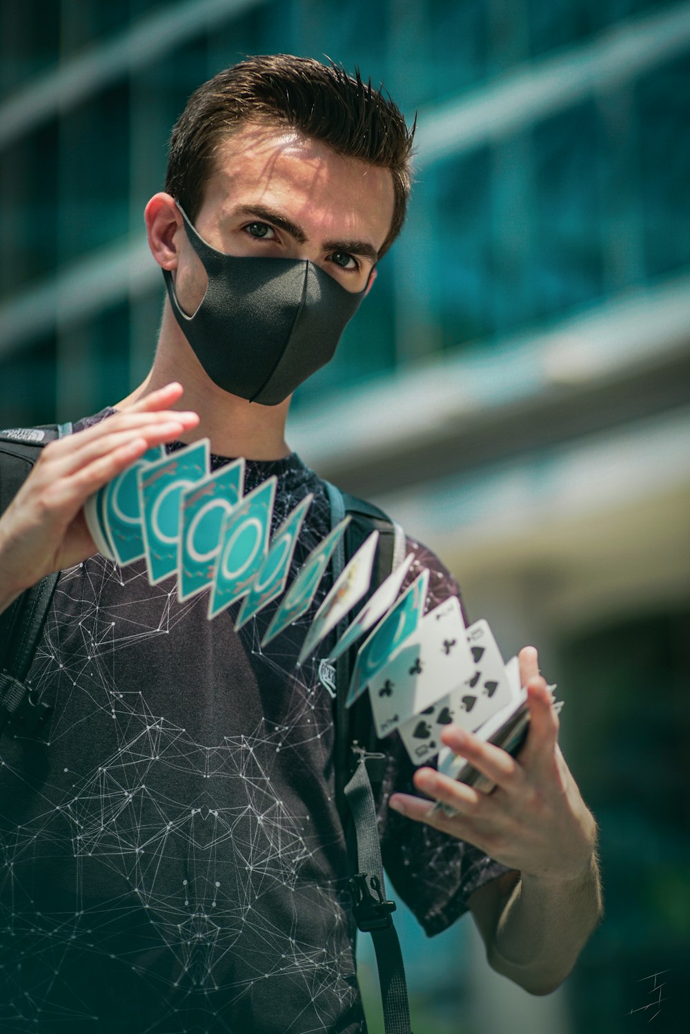 man in black and white shirt wearing black mask