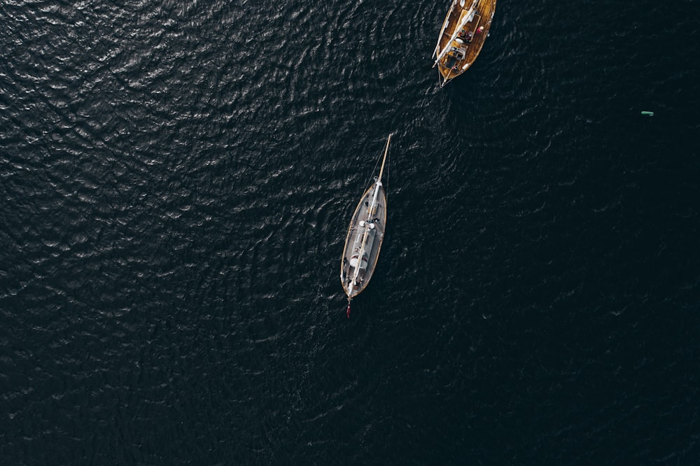 aerial view of white boat on body of water during daytime