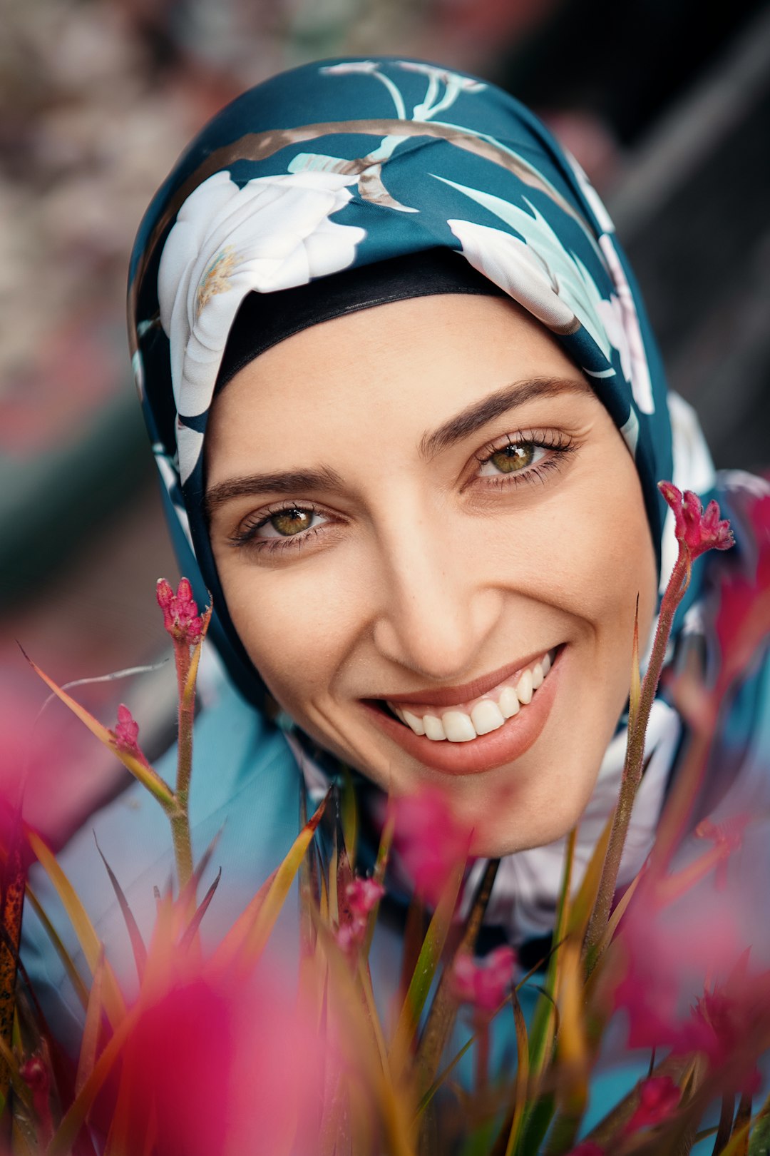 woman in white blue and green floral hijab