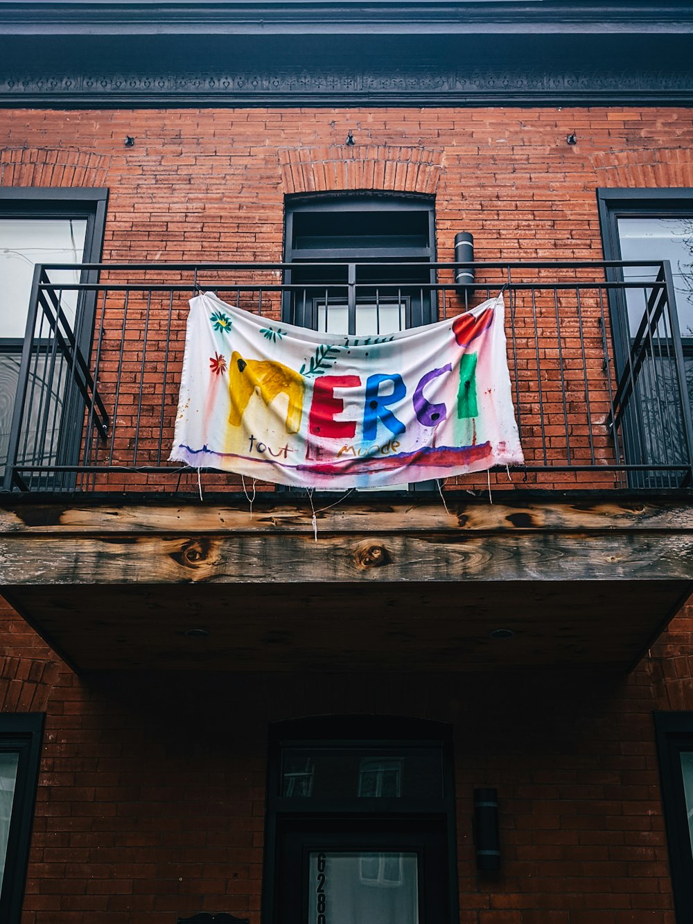 flags on brown wooden wall