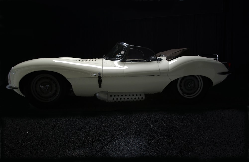 white classic car on black asphalt road