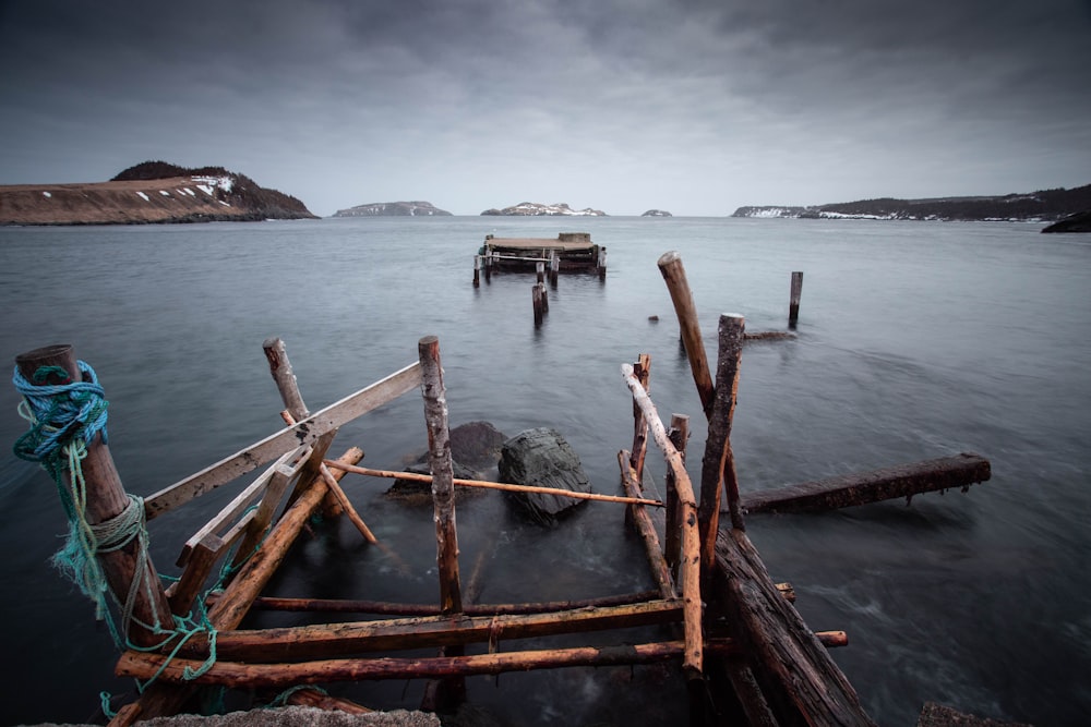 brown wooden boat on sea during daytime