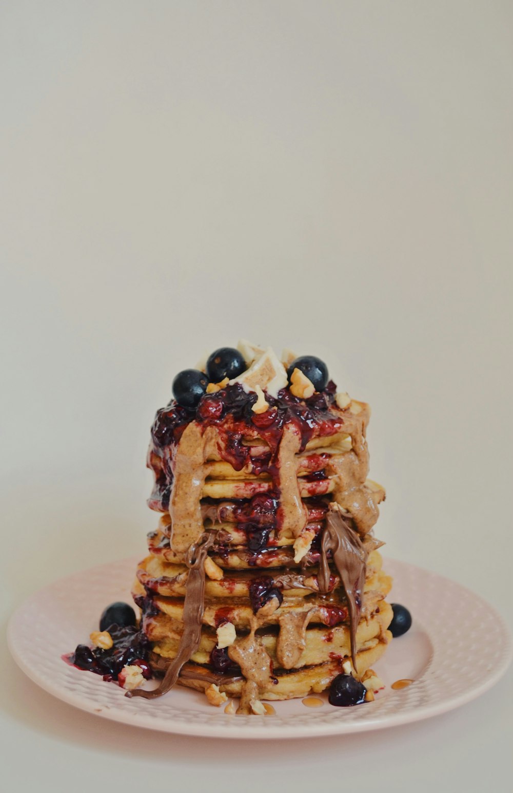 brown waffle with black berries on top