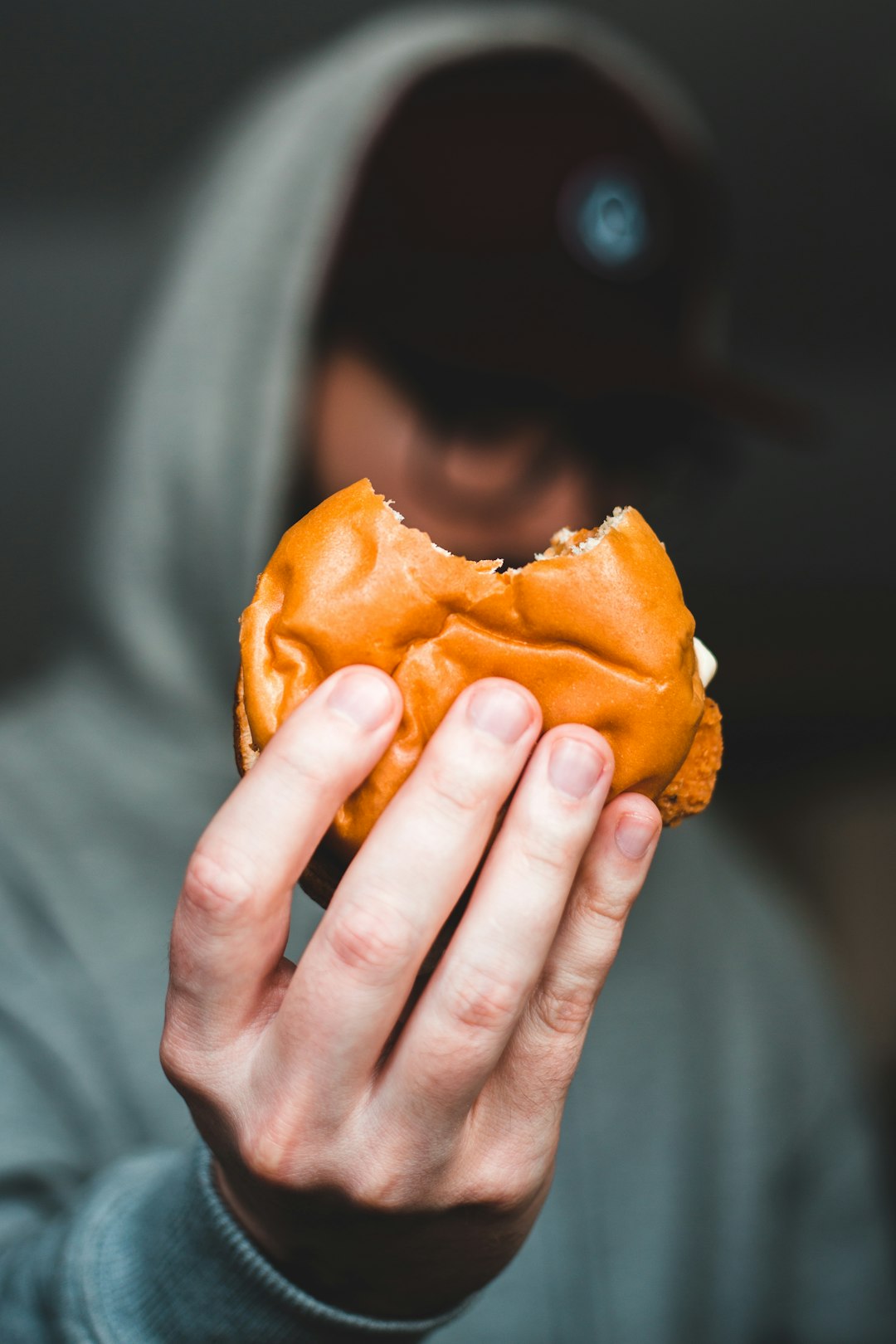 person holding a brown bread