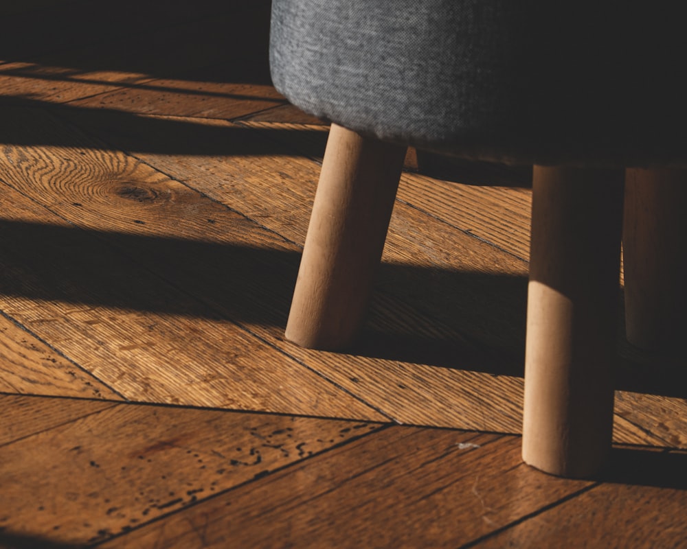 black round seat on brown wooden floor