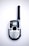 A handheld radio device with a black antenna, silver body, and numerous small buttons, including a push-to-talk button and a menu button. The screen is small and above the buttons, with the brand name visible below.
