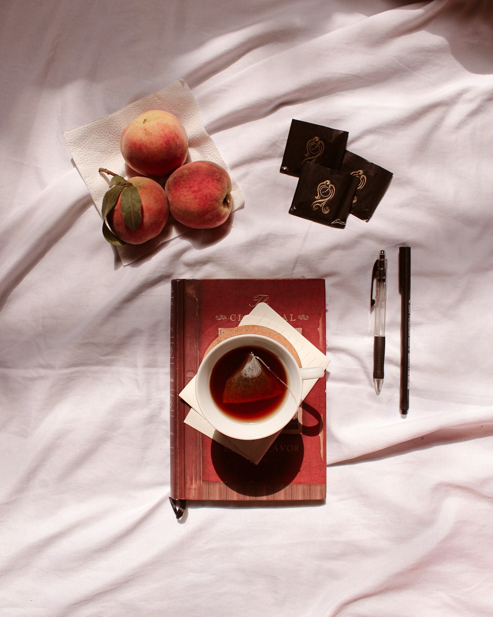 red apple fruit on white textile