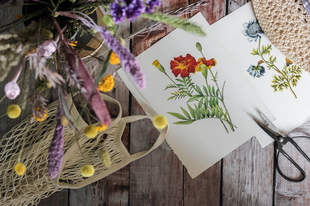 white and purple flowers on white paper