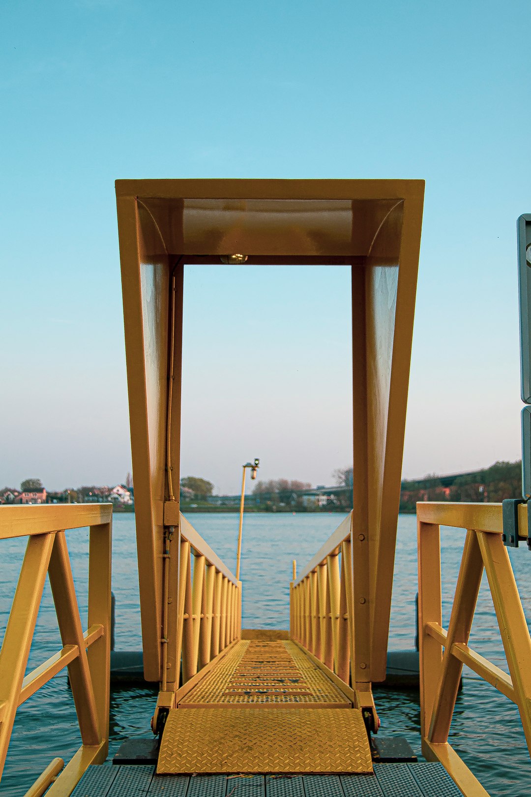 brown wooden bridge over the sea during daytime