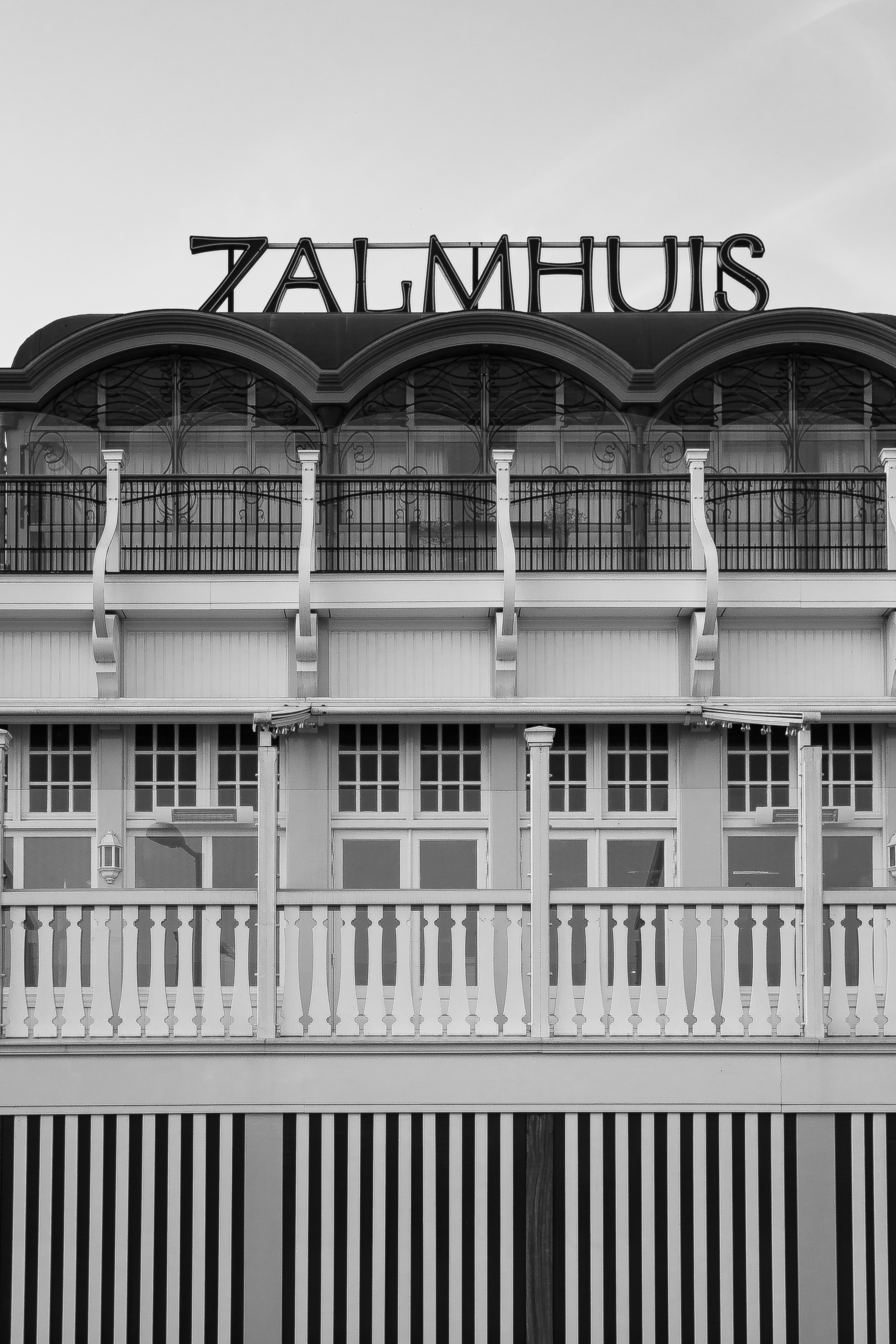 a tall building with a sign on top of it