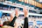 person in black long sleeve shirt raising hands