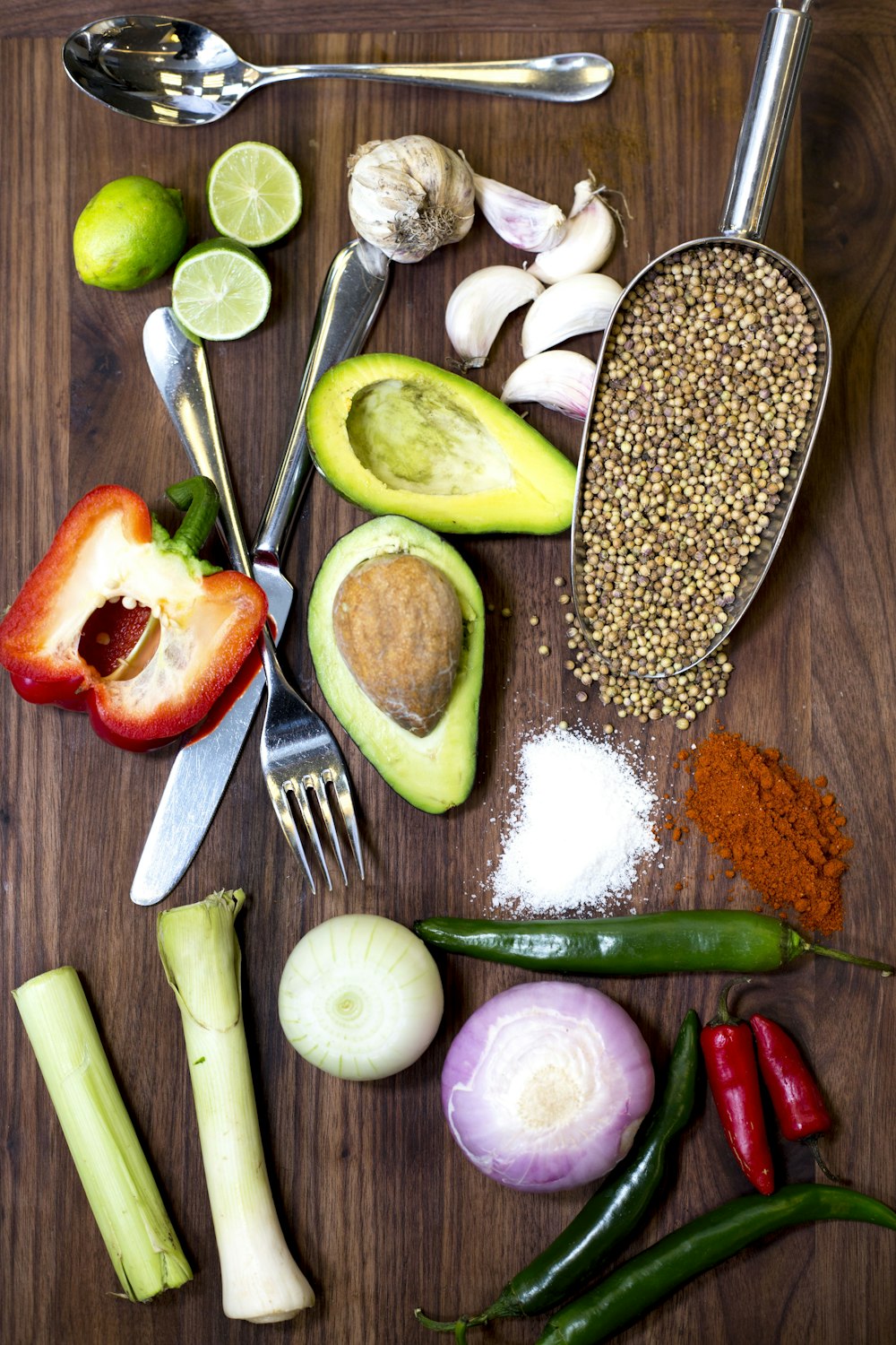 sliced avocado and tomato on chopping board