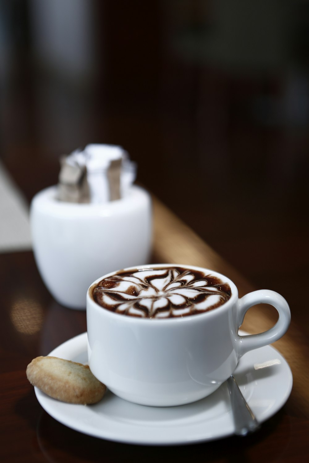 white ceramic cup with coffee