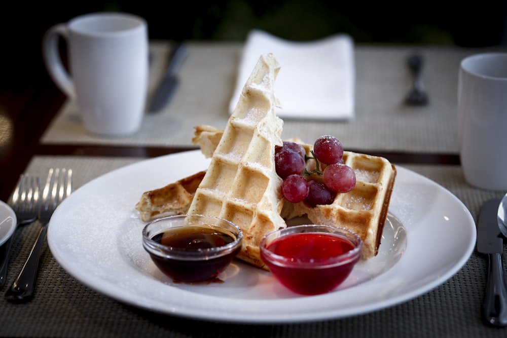 waffle with strawberry on white ceramic plate