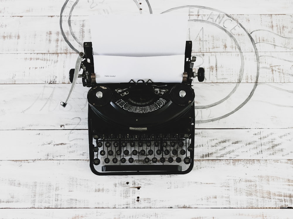 black and white typewriter on white paper