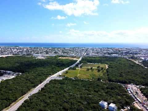 Satellite image capturing urban expansion next to green forest cover near Visakhapatnam.